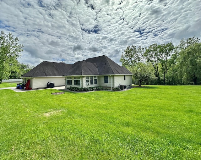 16 Hidden View Dr, Newburgh, NY 12550 - view of side of home with a lawn and cooling unit