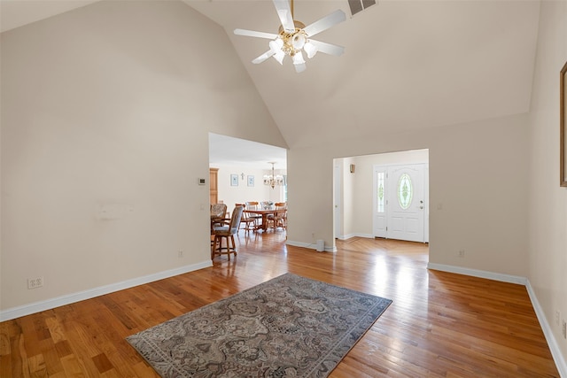 16 Hidden View Dr, Newburgh, NY 12550 - foyer entrance featuring a chandelier, high vaulted ceiling, ceiling fan, light wood-style flooring, and baseboards