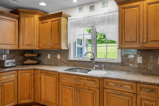 16 Hidden View Dr, Newburgh, NY 12550 - kitchen with a sink, brown cabinets, decorative backsplash, and recessed lighting