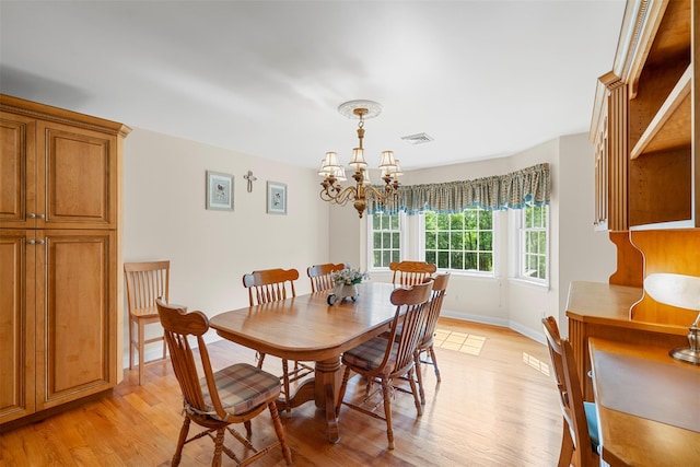 16 Hidden View Dr, Newburgh, NY 12550 - dining room featuring a chandelier, light wood-type flooring, and baseboards