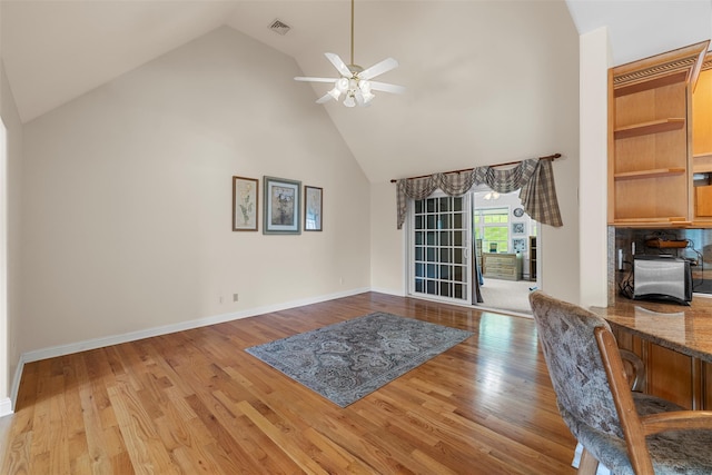 16 Hidden View Dr, Newburgh, NY 12550 - living room with high vaulted ceiling, ceiling fan, wood finished floors, a desk, and baseboards