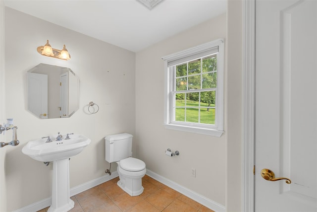 16 Hidden View Dr, Newburgh, NY 12550 - bathroom with toilet, baseboards, tile patterned floors, and a sink