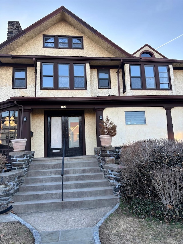 142 Cottage Ave, Mount Vernon, NY 10550 - townhome / multi-family property featuring stucco siding, french doors, and a chimney