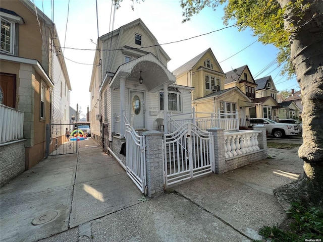 10920 116th St, South Ozone Park, NY 11420 - view of front of home with a gate and a residential view