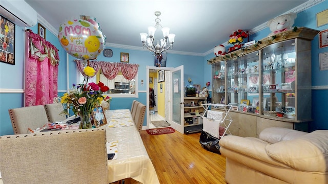 10920 116th St, South Ozone Park, NY 11420 - dining area featuring a chandelier, a wall unit AC, wood finished floors, and ornamental molding