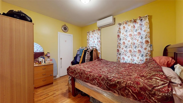 10920 116th St, South Ozone Park, NY 11420 - bedroom featuring light wood-style flooring and an AC wall unit