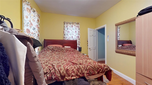 10920 116th St, South Ozone Park, NY 11420 - bedroom with wood finished floors and baseboards