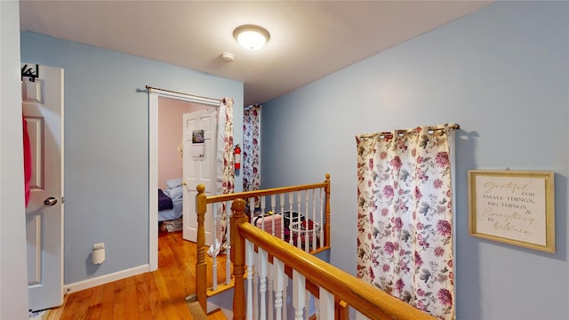 10920 116th St, South Ozone Park, NY 11420 - hall featuring an upstairs landing and wood finished floors