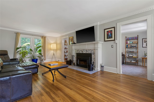 225 Fisher Ave, White Plains, NY 10606 - living area featuring wood finished floors, a fireplace, and crown molding