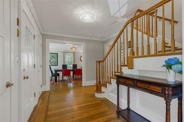 225 Fisher Ave, White Plains, NY 10606 - entryway featuring stairs, wood finished floors, and ornamental molding