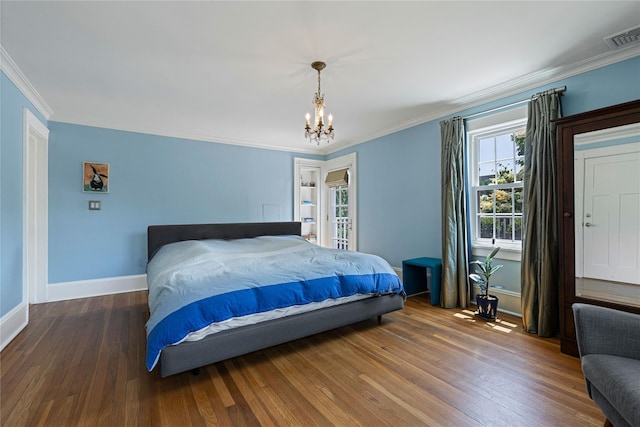 225 Fisher Ave, White Plains, NY 10606 - bedroom with crown molding, wood finished floors, and a chandelier