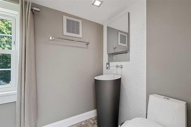 225 Fisher Ave, White Plains, NY 10606 - bathroom with toilet and tile walls