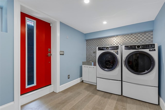 225 Fisher Ave, White Plains, NY 10606 - laundry area with cabinet space, washing machine and clothes dryer, light wood-style floors, and recessed lighting