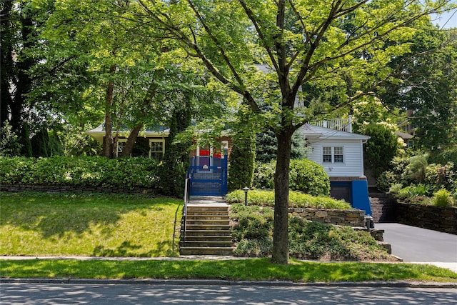 225 Fisher Ave, White Plains, NY 10606 - view of property hidden behind natural elements featuring stairway, concrete driveway, and an attached garage
