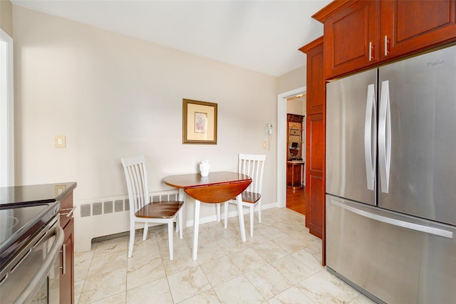 18 Lorraine Blvd, Poughkeepsie, NY 12603 - dining area featuring radiator heating unit and baseboards