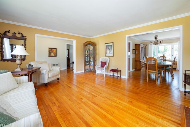 18 Lorraine Blvd, Poughkeepsie, NY 12603 - living area with a chandelier, light wood-style flooring, ornamental molding, and baseboards