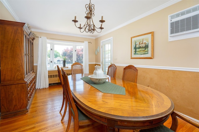 18 Lorraine Blvd, Poughkeepsie, NY 12603 - dining space featuring radiator, a wall mounted AC, light wood-type flooring, a chandelier, and crown molding