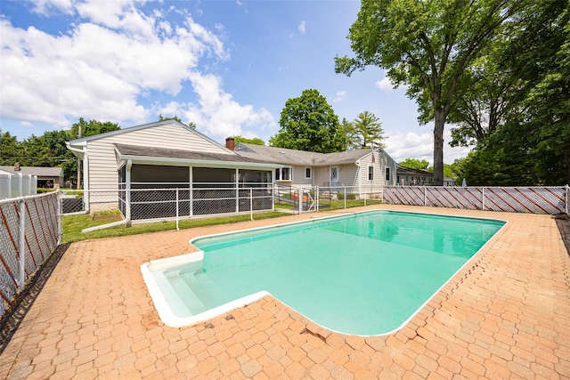 18 Lorraine Blvd, Poughkeepsie, NY 12603 - view of swimming pool featuring a sunroom, a fenced backyard, and a patio
