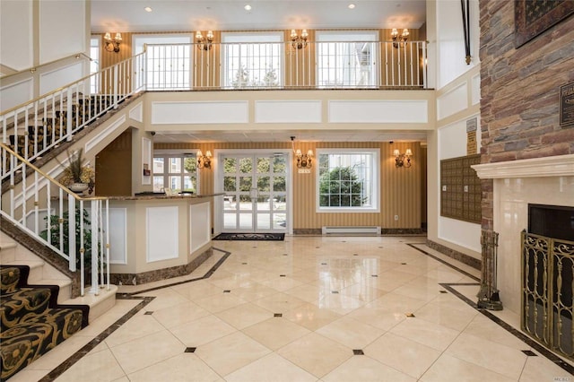 150-31 12th Ave Unit 112, Whitestone, NY 11357 - building lobby with a high ceiling, stairway, and recessed lighting