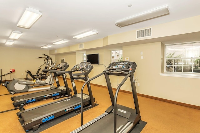 150-31 12th Ave Unit 112, Whitestone, NY 11357 - exercise room featuring baseboards and carpet flooring