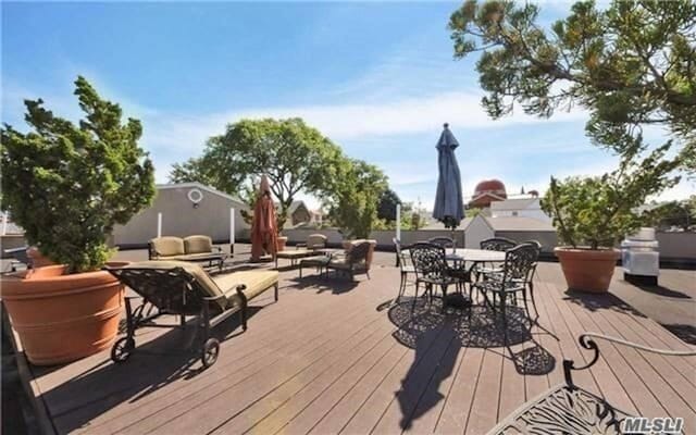 150-31 12th Ave Unit 112, Whitestone, NY 11357 - deck with outdoor dining space and an outdoor living space