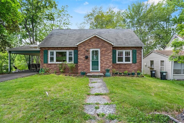 5 Fairview Ave, New Paltz, NY 12561 - bungalow with brick siding, a carport, roof with shingles, and a front lawn
