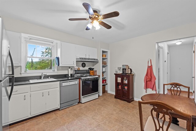 5 Fairview Ave, New Paltz, NY 12561 - kitchen featuring dishwashing machine, gas range gas stove, a sink, dark countertops, and freestanding refrigerator