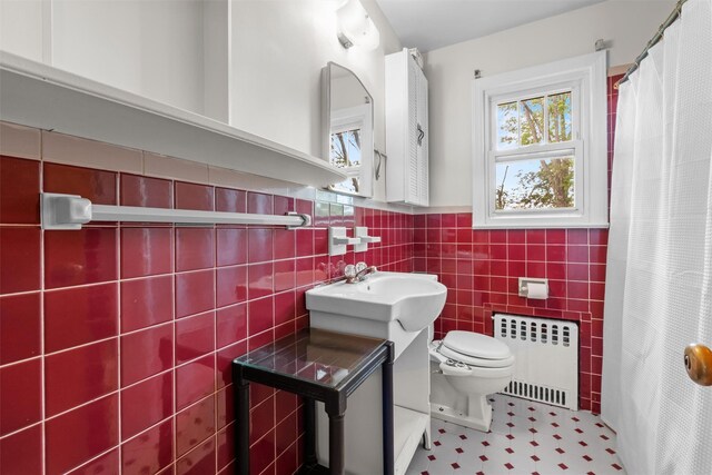 5 Fairview Ave, New Paltz, NY 12561 - full bathroom featuring radiator, toilet, tile walls, a wainscoted wall, and curtained shower