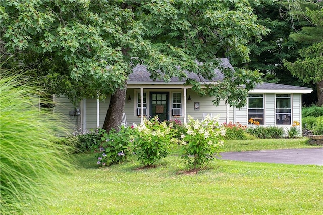 184 Sawchuck Rd, Millerton, NY 12546 - view of front of property with a front lawn, cooling unit, a shingled roof, and a porch