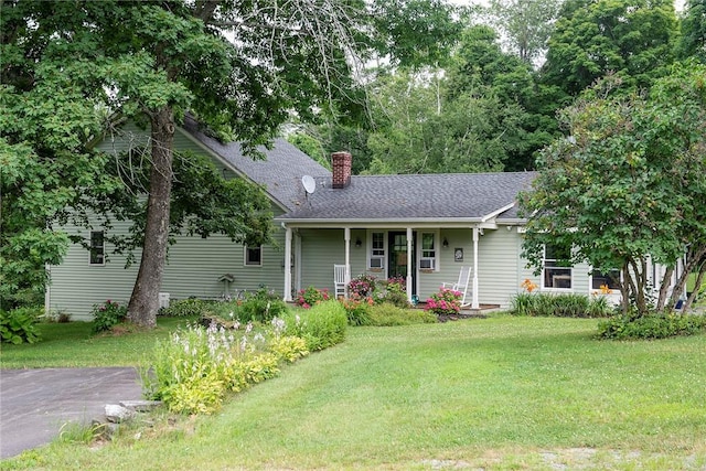 184 Sawchuck Rd, Millerton, NY 12546 - view of front of property featuring a chimney, covered porch, a front yard, and a shingled roof