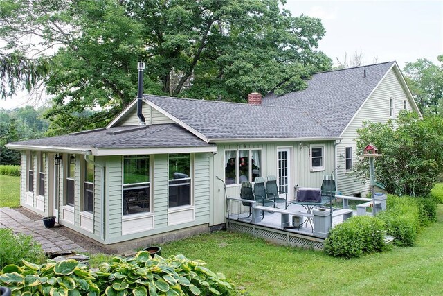 184 Sawchuck Rd, Millerton, NY 12546 - back of house with a shingled roof, a deck, a chimney, and a yard