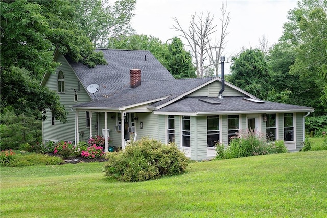 184 Sawchuck Rd, Millerton, NY 12546 - view of front facade featuring a shingled roof, a front lawn, and a chimney