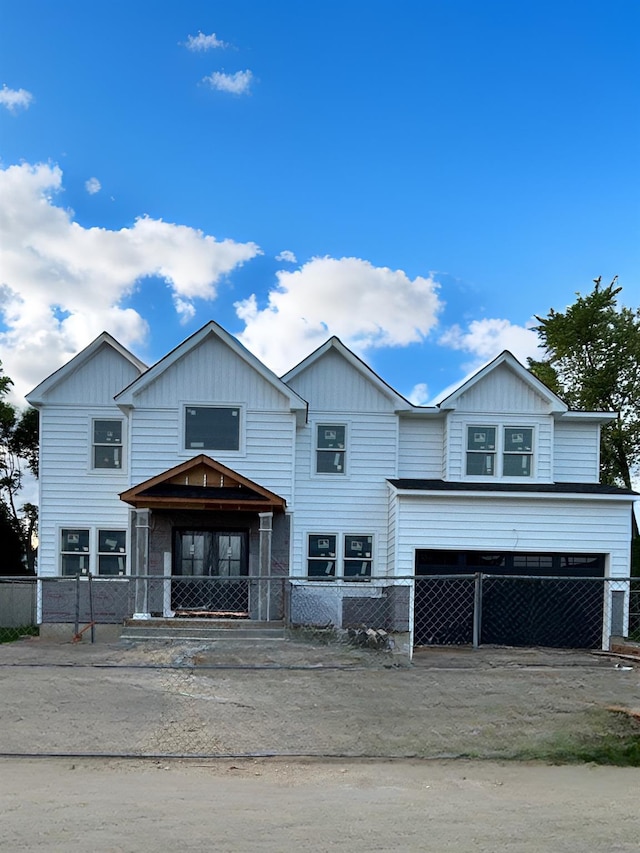 7 Eton Pl, Plainview, NY 11803 - view of front facade featuring board and batten siding and an attached garage