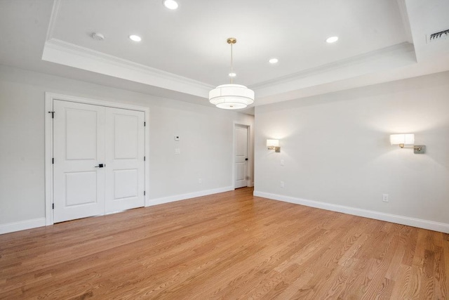 7 Eton Pl, Plainview, NY 11803 - unfurnished room with a raised ceiling, crown molding, light wood finished floors, baseboards, and recessed lighting