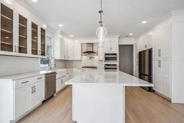 7 Eton Pl, Plainview, NY 11803 - kitchen with stainless steel appliances, wall chimney range hood, light wood-style flooring, white cabinets, and recessed lighting