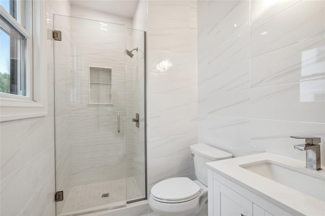 7 Eton Pl, Plainview, NY 11803 - bathroom featuring a stall shower, vanity, and tile walls