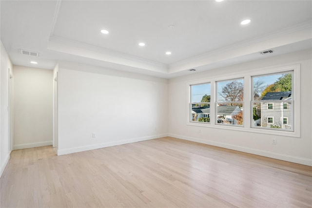 7 Eton Pl, Plainview, NY 11803 - spare room with a tray ceiling, ornamental molding, light wood-style floors, and recessed lighting