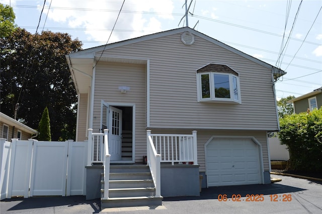 294 Fir Grove Rd, Ronkonkoma, NY 11779 - view of front of property with a garage and asphalt driveway