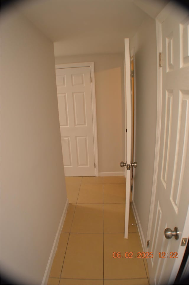 294 Fir Grove Rd, Ronkonkoma, NY 11779 - corridor with tile patterned flooring and baseboards