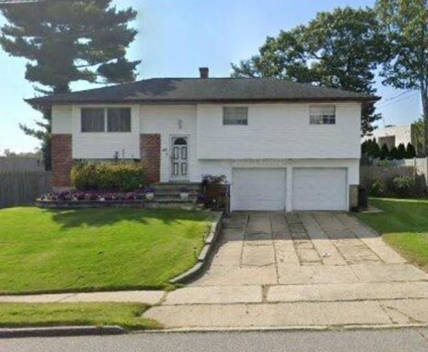 46 Sunburst Dr, Deer Park, NY 11729 - bi-level home with a garage, a front yard, and driveway