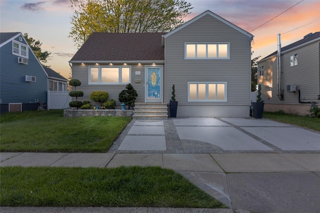 22 Martha St, Freeport, NY 11520 - tri-level home featuring a front lawn and entry steps