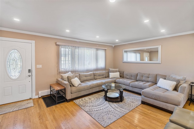 22 Martha St, Freeport, NY 11520 - living room featuring wood finished floors, crown molding, recessed lighting, baseboards, and baseboard heating