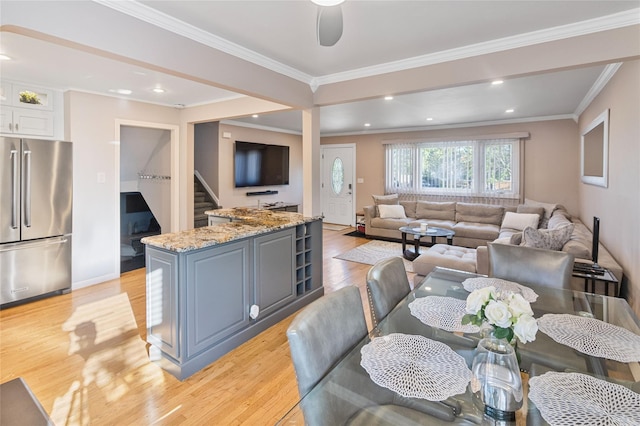 22 Martha St, Freeport, NY 11520 - living area featuring light wood finished floors, stairs, crown molding, recessed lighting, and baseboards