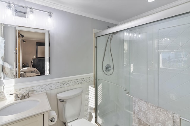 22 Martha St, Freeport, NY 11520 - bathroom with vanity, ornamental molding, toilet, a stall shower, and a wainscoted wall