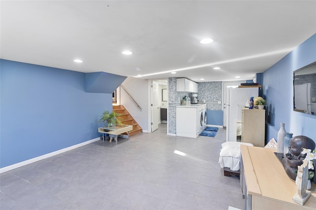 22 Martha St, Freeport, NY 11520 - living room featuring recessed lighting, stairway, baseboards, washer / clothes dryer, and light tile patterned flooring