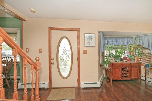 29 Andrew Ln, Levittown, NY 11756 - foyer entrance with dark wood finished floors, a baseboard heating unit, and plenty of natural light