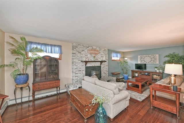 29 Andrew Ln, Levittown, NY 11756 - living area with wood finished floors, a brick fireplace, and a baseboard heating unit