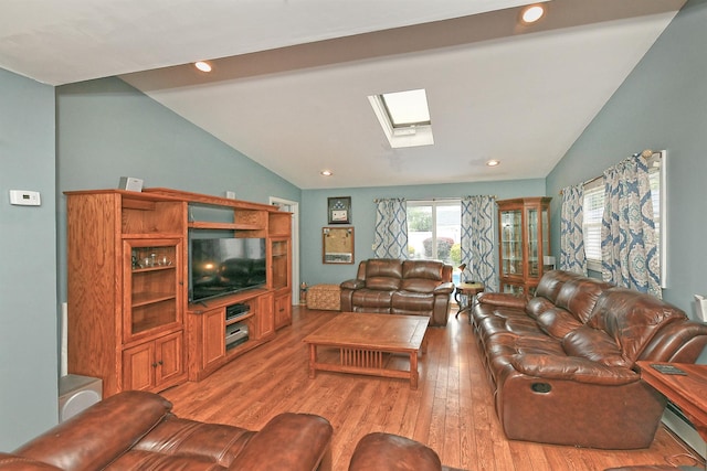 29 Andrew Ln, Levittown, NY 11756 - living area with vaulted ceiling, a skylight, light wood-type flooring, and recessed lighting