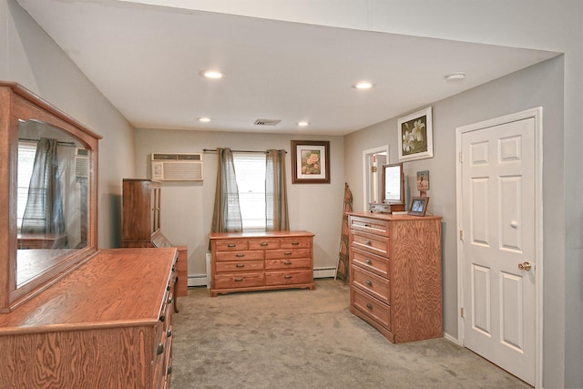 29 Andrew Ln, Levittown, NY 11756 - bedroom with light colored carpet, recessed lighting, a wall unit AC, a baseboard radiator, and baseboards