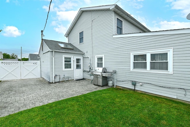 29 Andrew Ln, Levittown, NY 11756 - back of property featuring a gate and a patio